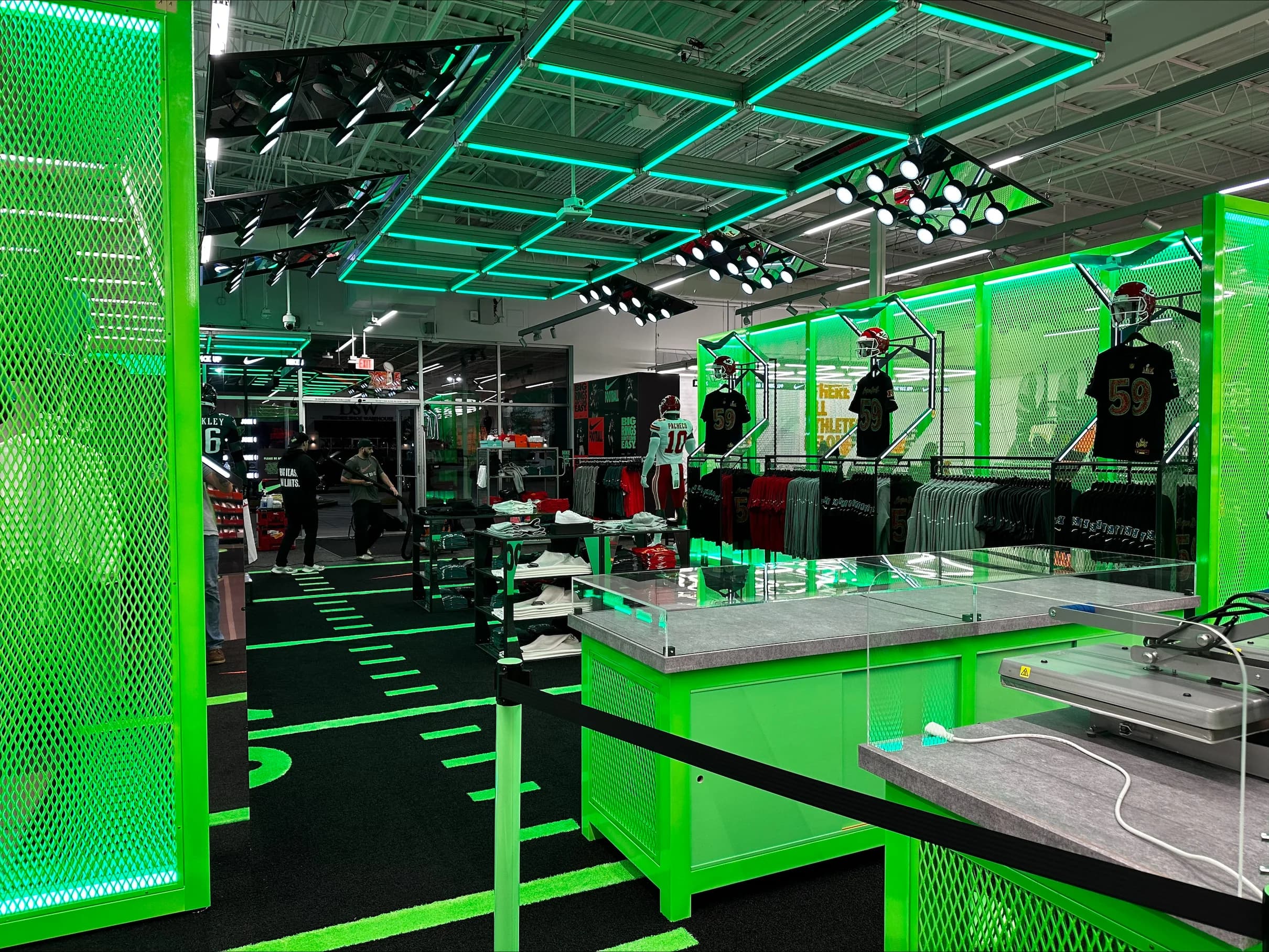 Bright green branded retail environment installation by AP Installations