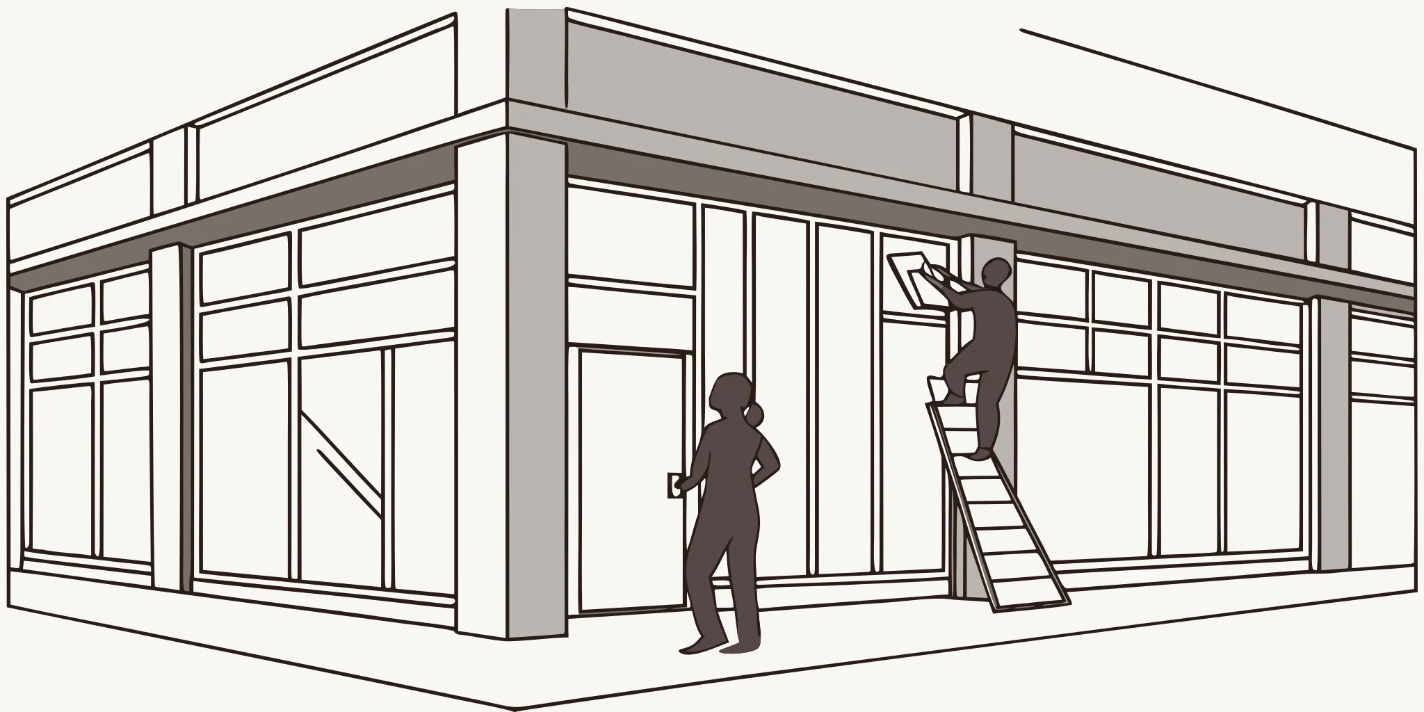 Professional installer applying vinyl graphics during a retail store rebrand